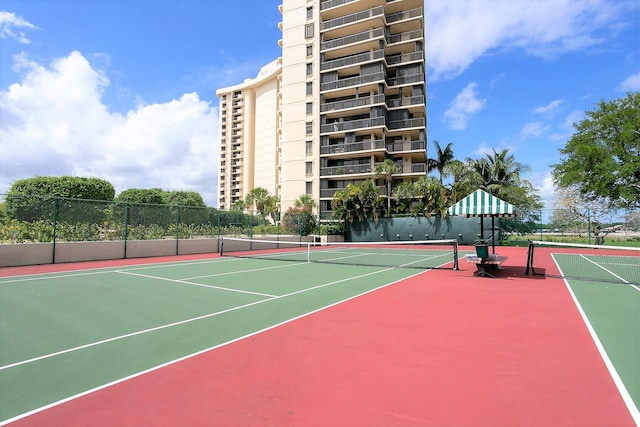 view of tennis court featuring basketball court