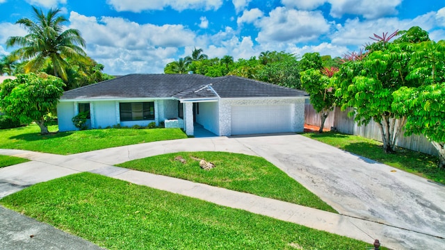 single story home with a garage and a front yard