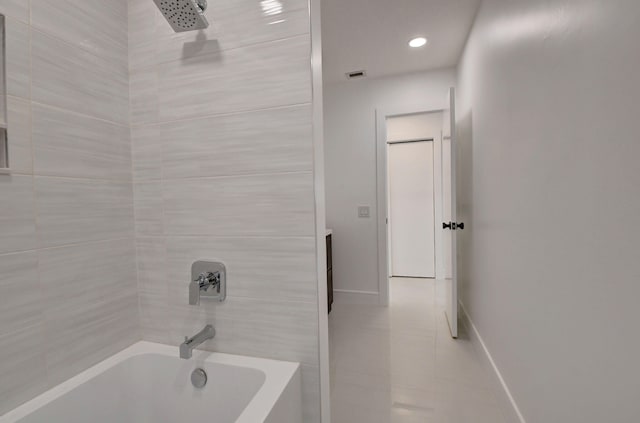 bathroom featuring tile patterned floors and tub / shower combination