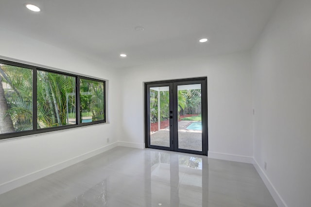 unfurnished room with french doors