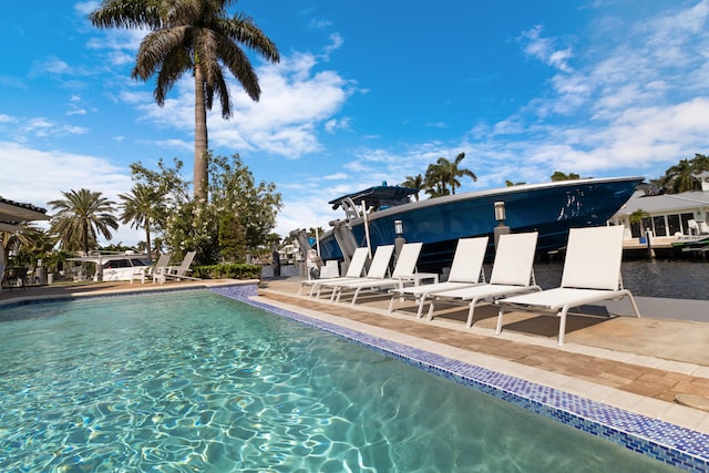 view of swimming pool featuring a patio