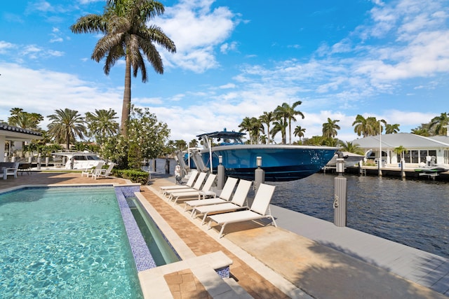 view of swimming pool featuring a water view