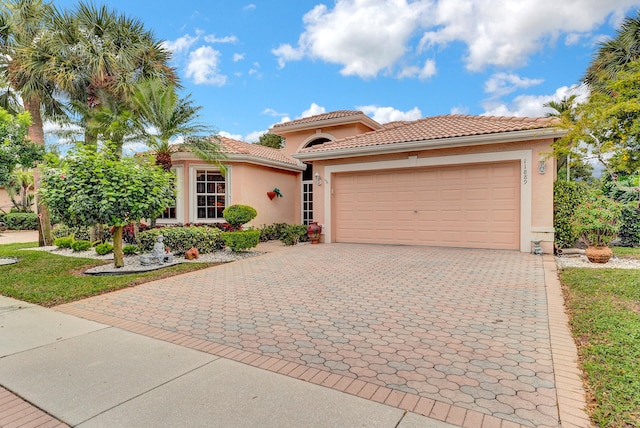 mediterranean / spanish-style home featuring a garage