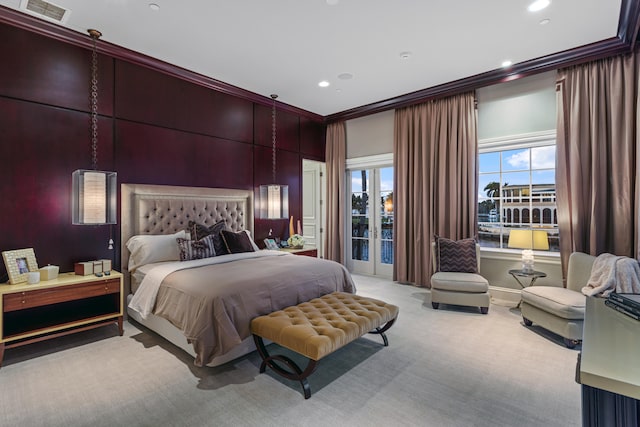 bedroom with ornamental molding, access to outside, and light colored carpet