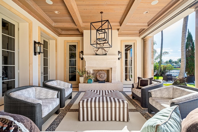 view of patio / terrace with an outdoor living space with a fireplace