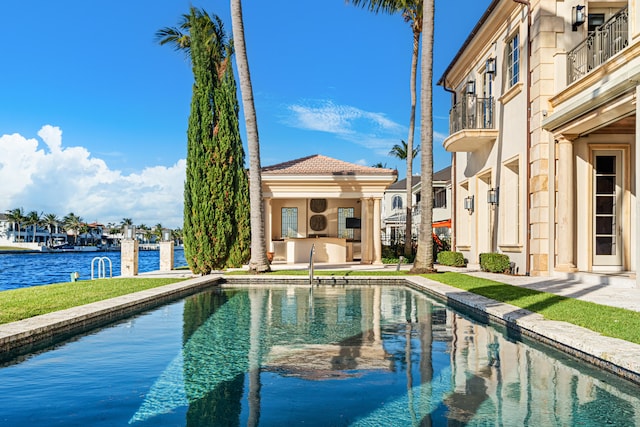 view of pool featuring a water view