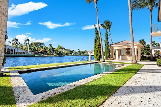 view of swimming pool with a water view