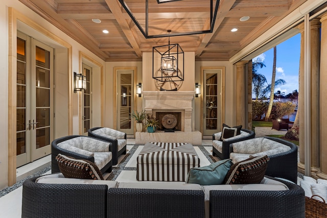 view of patio featuring an outdoor living space with a fireplace and french doors