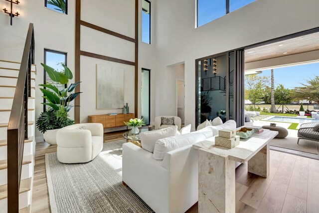 dining area featuring hardwood / wood-style floors and beam ceiling