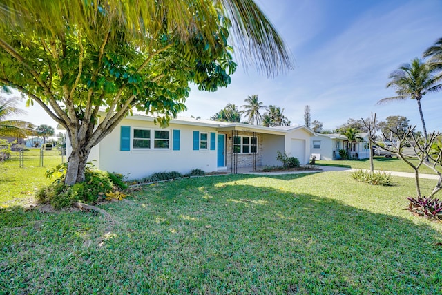 ranch-style home with a front yard