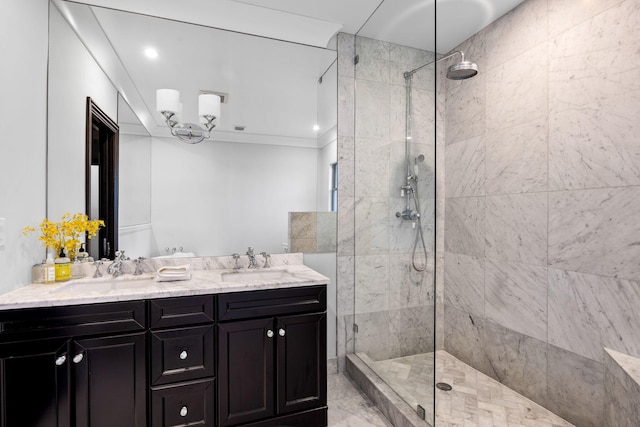 bathroom with vanity and tiled shower