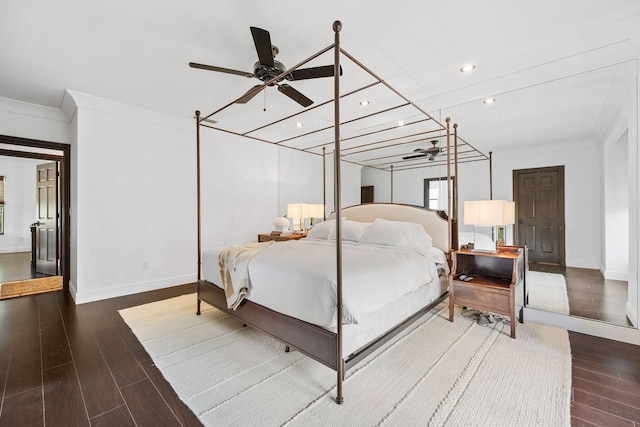 bedroom with hardwood / wood-style floors, crown molding, and ceiling fan