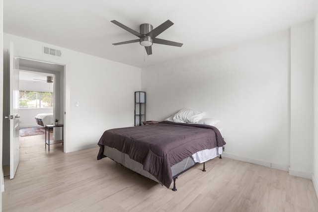 bedroom featuring light wood-type flooring and ceiling fan