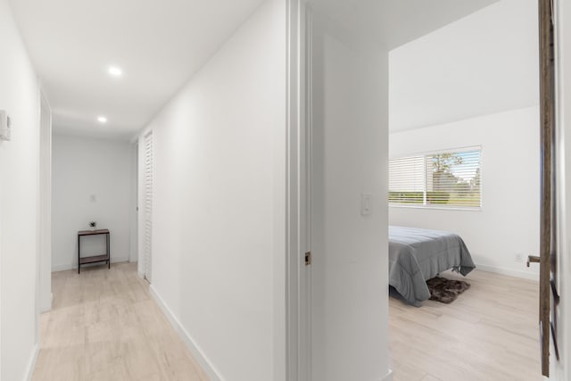 hall with light hardwood / wood-style floors