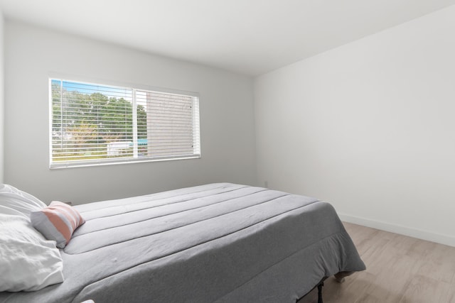 bedroom with hardwood / wood-style floors