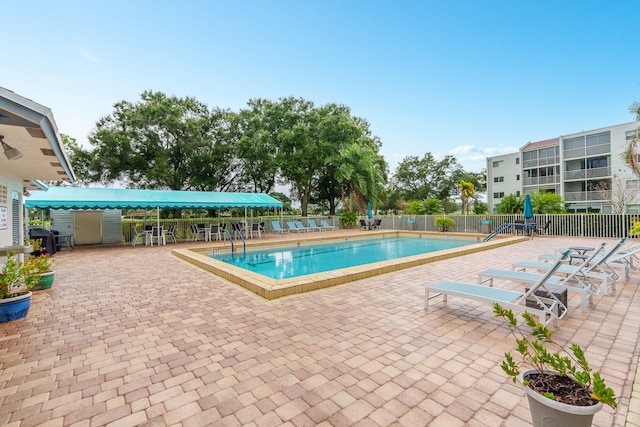 view of swimming pool featuring a patio area