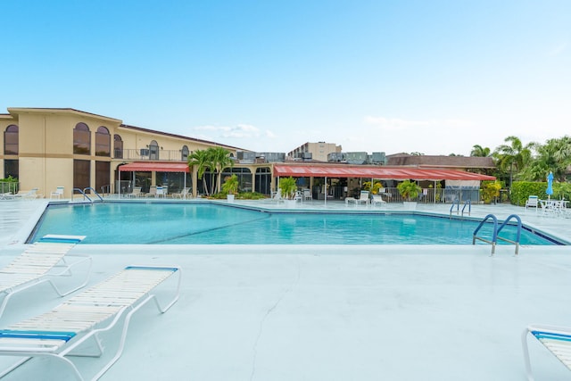 view of swimming pool with a patio