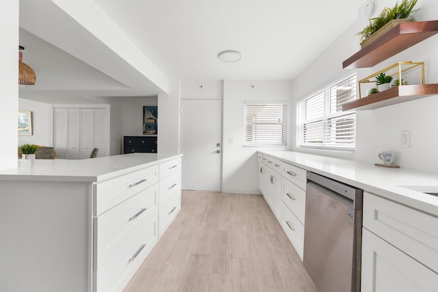 kitchen featuring dishwasher, white cabinets, and light wood-type flooring