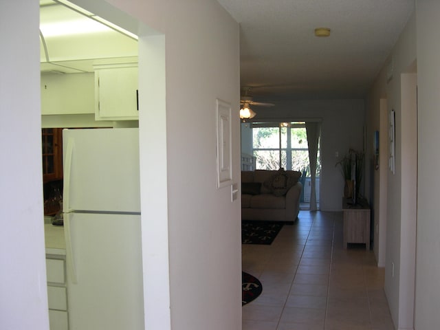 hallway featuring tile floors