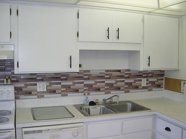 kitchen featuring dishwashing machine, range, backsplash, sink, and white cabinets