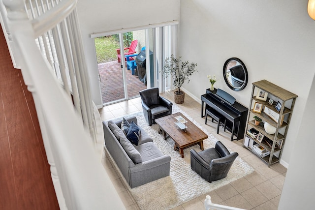 living room featuring tile patterned flooring and baseboards