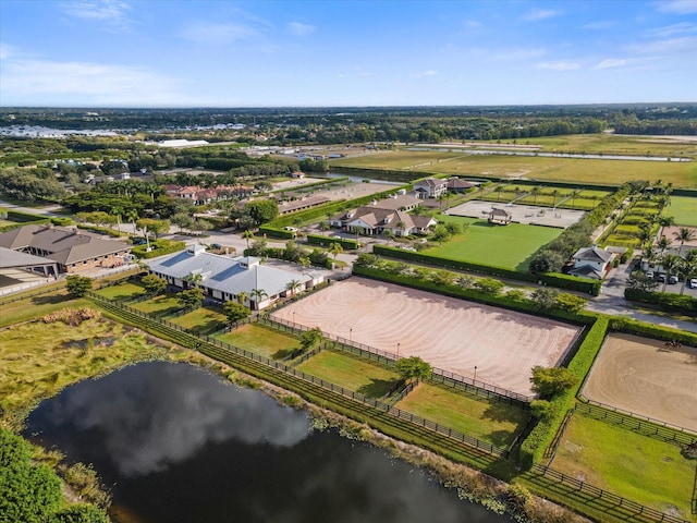 birds eye view of property with a water view and a rural view