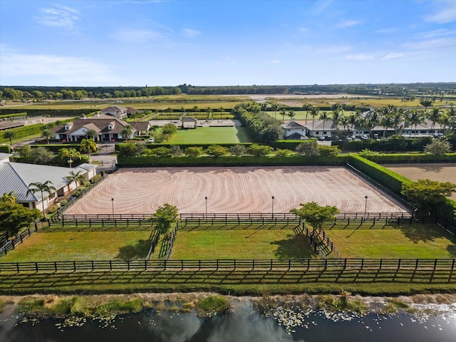 birds eye view of property featuring a rural view and a water view