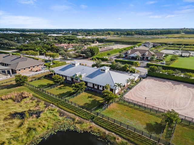 aerial view with a rural view and a water view