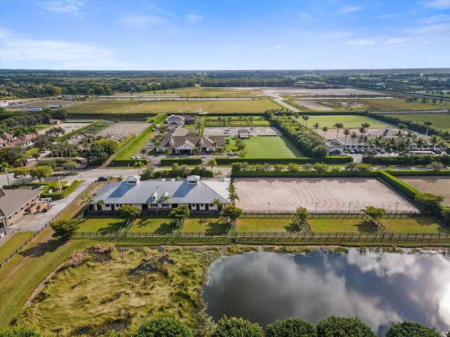 drone / aerial view with a water view and a rural view