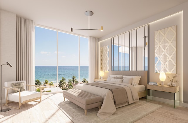 bedroom featuring floor to ceiling windows, a water view, and wood-type flooring