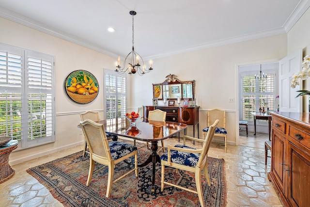 dining room with crown molding and an inviting chandelier