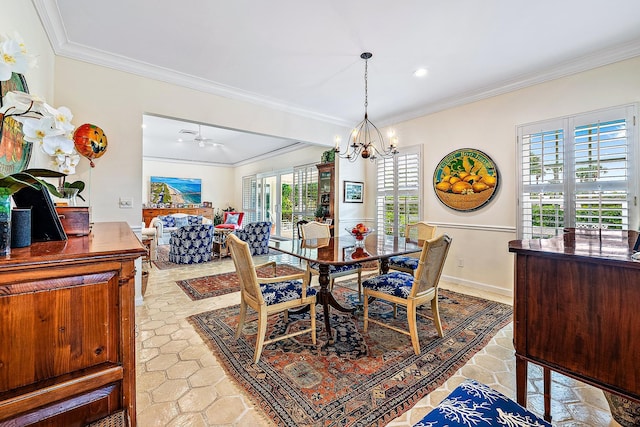 dining space with ceiling fan with notable chandelier, ornamental molding, and a healthy amount of sunlight