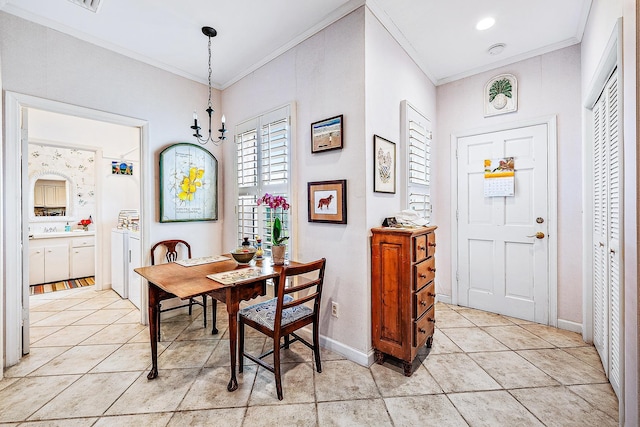 dining area with ornamental molding, washer / dryer, and light tile patterned flooring