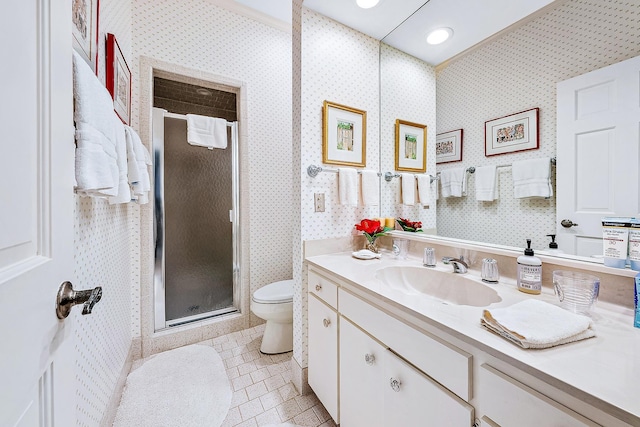 bathroom featuring a shower with door, vanity, toilet, and tile patterned flooring