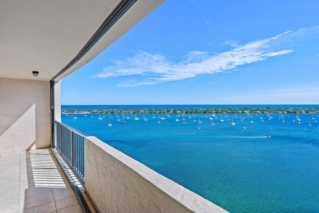 balcony featuring a water view