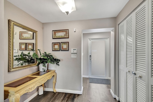 corridor featuring dark hardwood / wood-style flooring