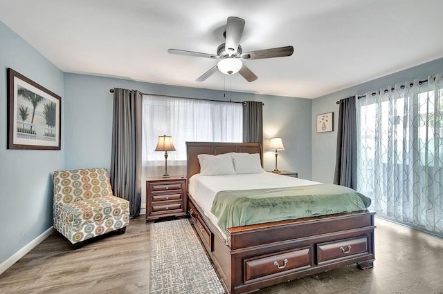 bedroom featuring hardwood / wood-style floors and ceiling fan