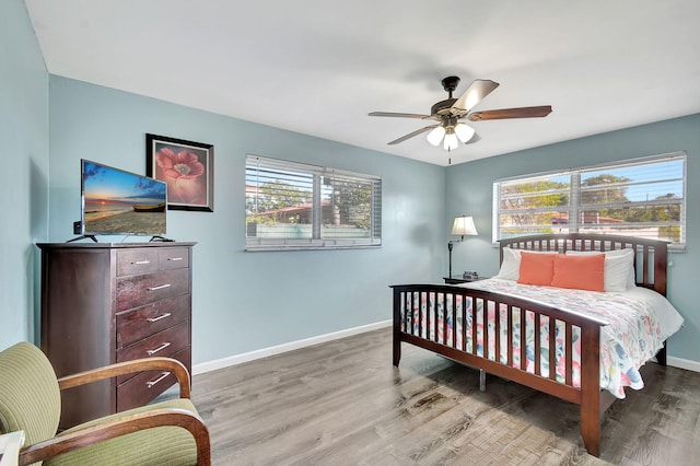 bedroom featuring light wood-type flooring and ceiling fan