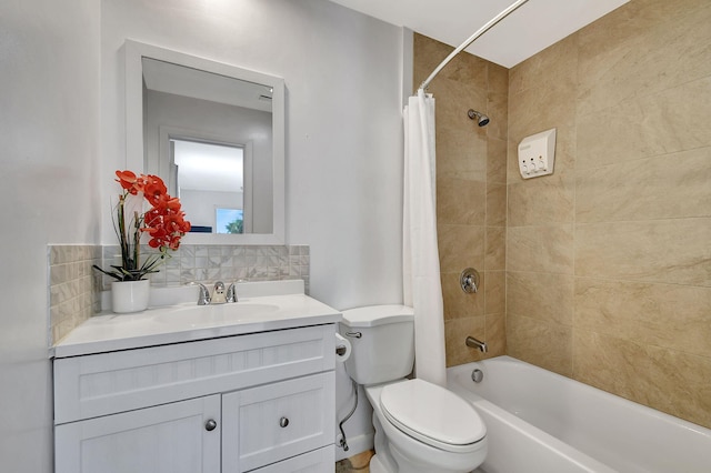 full bathroom with backsplash, toilet, vanity, and shower / bathtub combination with curtain