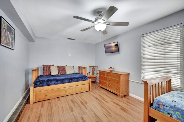 bedroom featuring ceiling fan and light hardwood / wood-style flooring