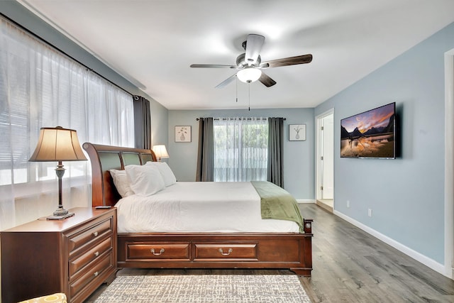 bedroom featuring ceiling fan and hardwood / wood-style floors