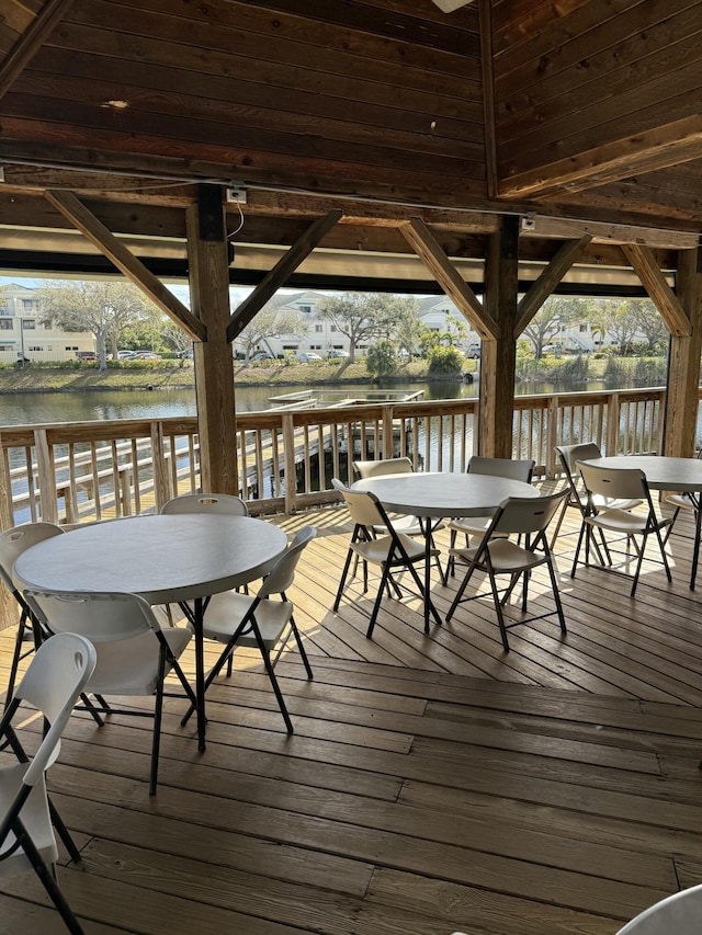 wooden deck featuring a water view