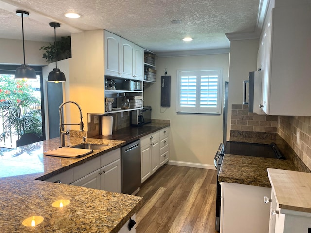 kitchen with sink, white cabinetry, decorative light fixtures, a textured ceiling, and stainless steel dishwasher