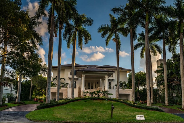 view of outdoor building at dusk