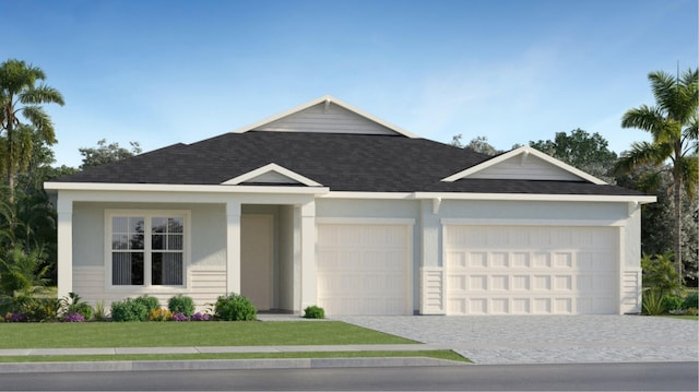 ranch-style house featuring a front yard and a garage