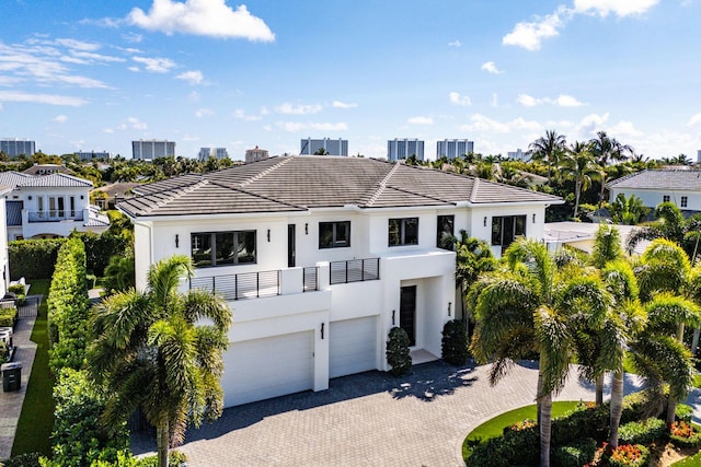 view of front of house featuring a balcony and a garage