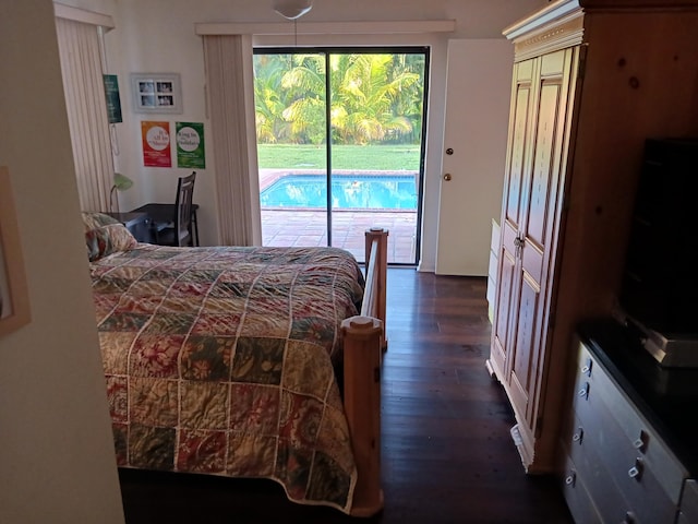 bedroom with access to outside and dark wood-type flooring