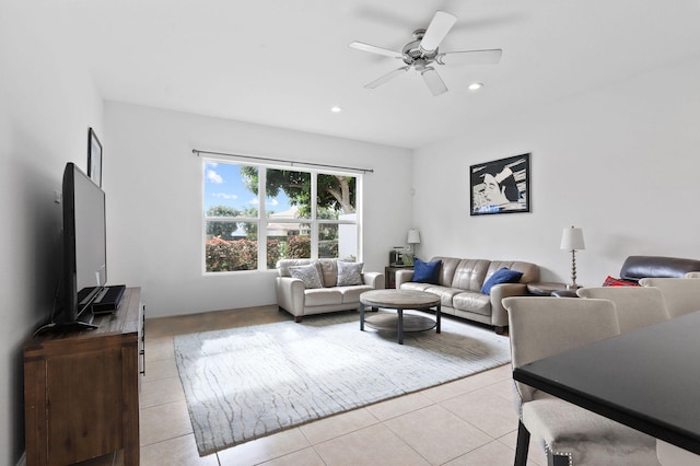 living room featuring ceiling fan and light tile floors