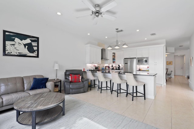 143 Isle Verde Way, Palm Beach Gardens, FL 33418 - living room with light tile patterned floors, ceiling fan, and recessed lighting