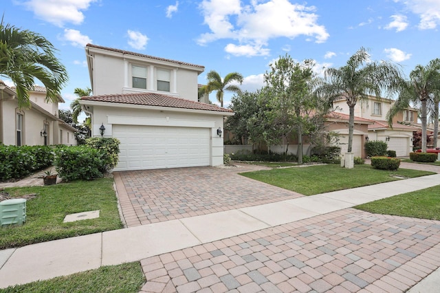 143 Isle Verde Way, Palm Beach Gardens, FL 33418 - mediterranean / spanish-style home with decorative driveway, a front lawn, a tiled roof, stucco siding, and a garage